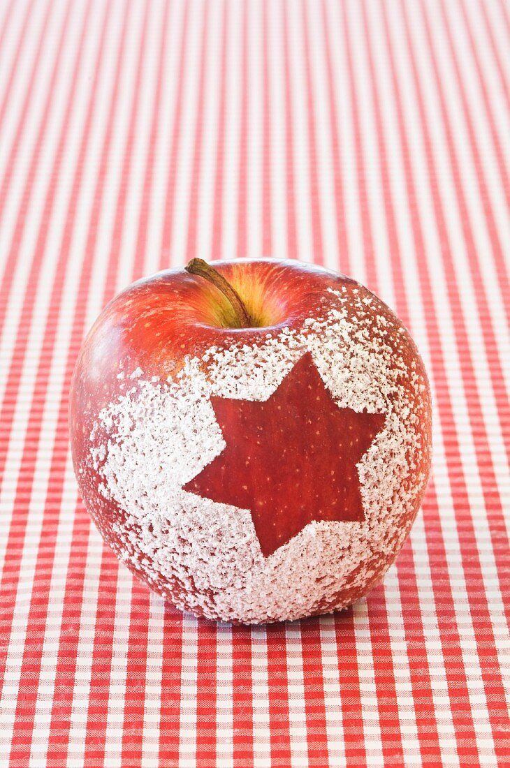 A Christmas apple decorated with a snow star