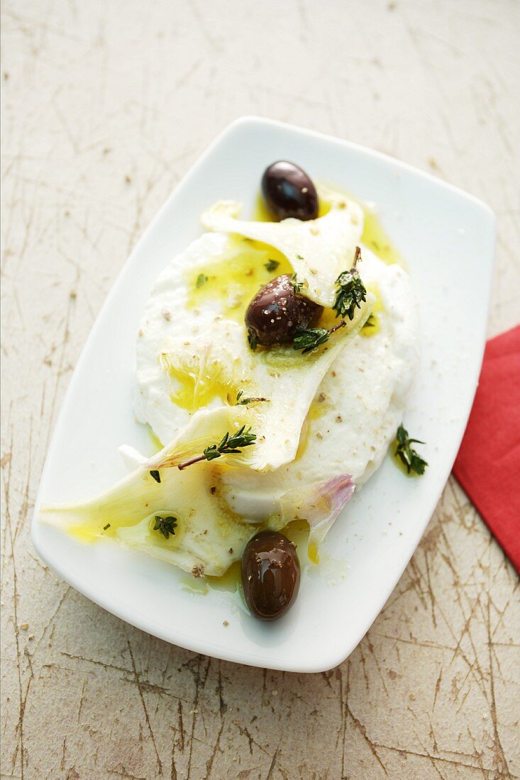 Artichokes with goat's cheese, olive oil and olives