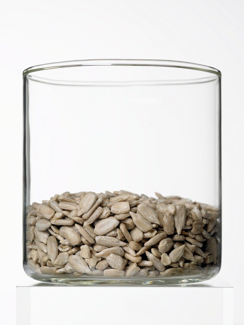 Shelled sunflower seeds in a glass container
