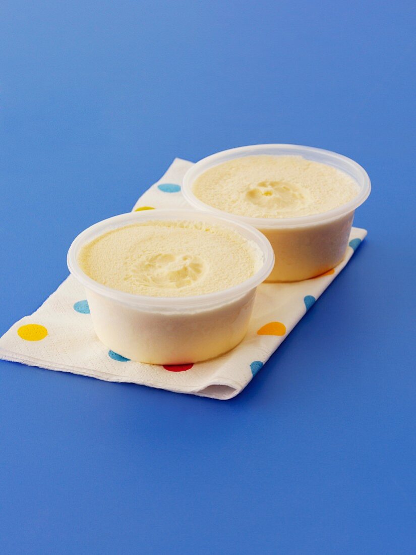 Vanilla ice cream in plastic bowls