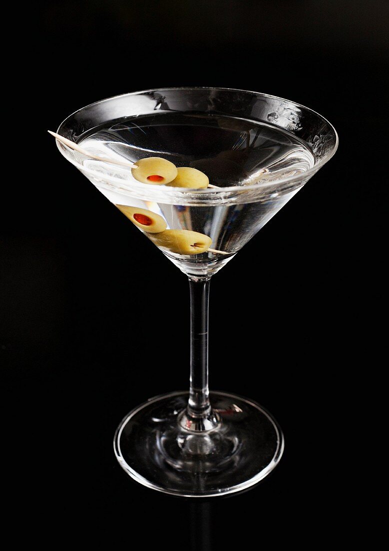 A martini against a black background