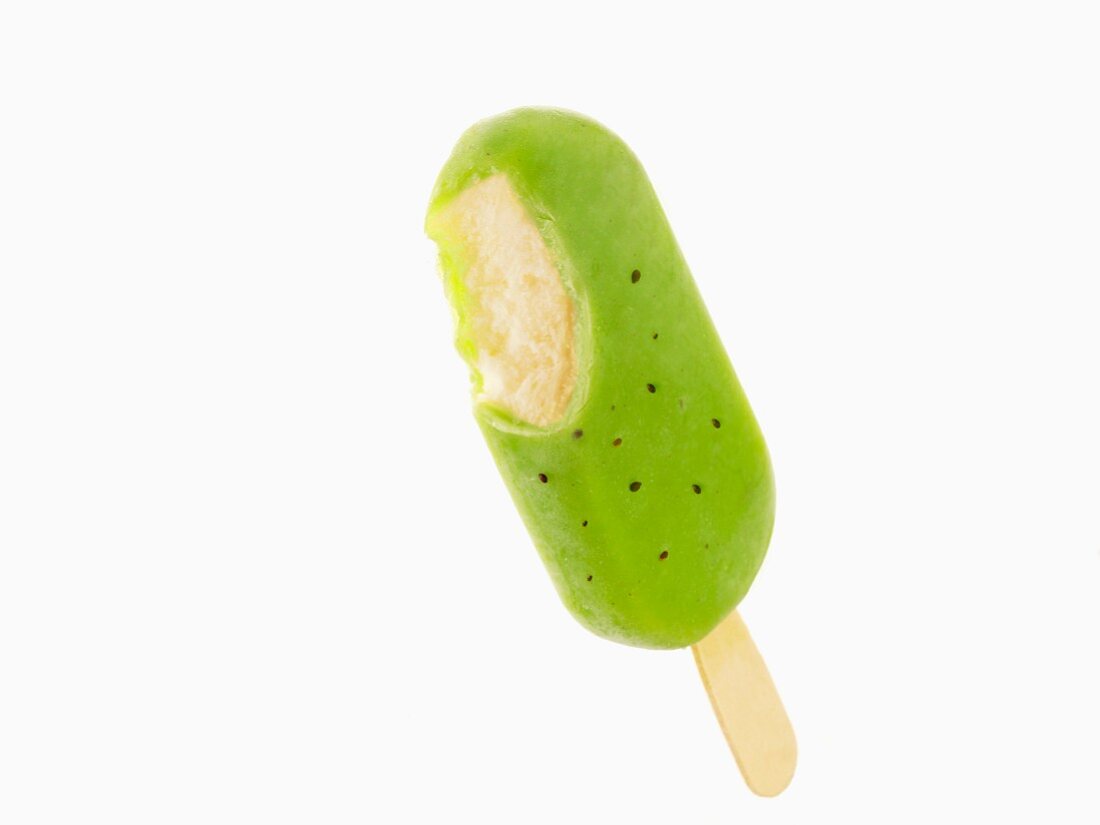 A pineapple ice cream stick with a kiwi glaze