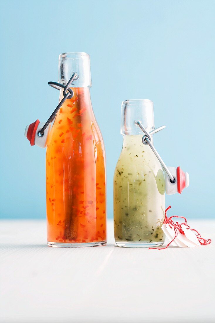 Chilli sauce with cinnamon and wasabi sauce in flip-top bottles