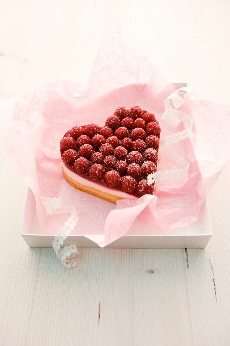 A heart-shaped raspberry tart with vanilla-quark cream