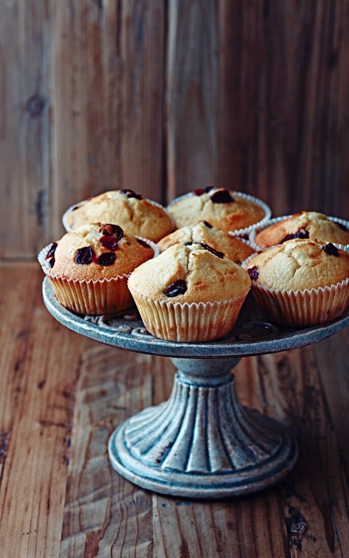Muffins with dried cranberries on a cake stand
