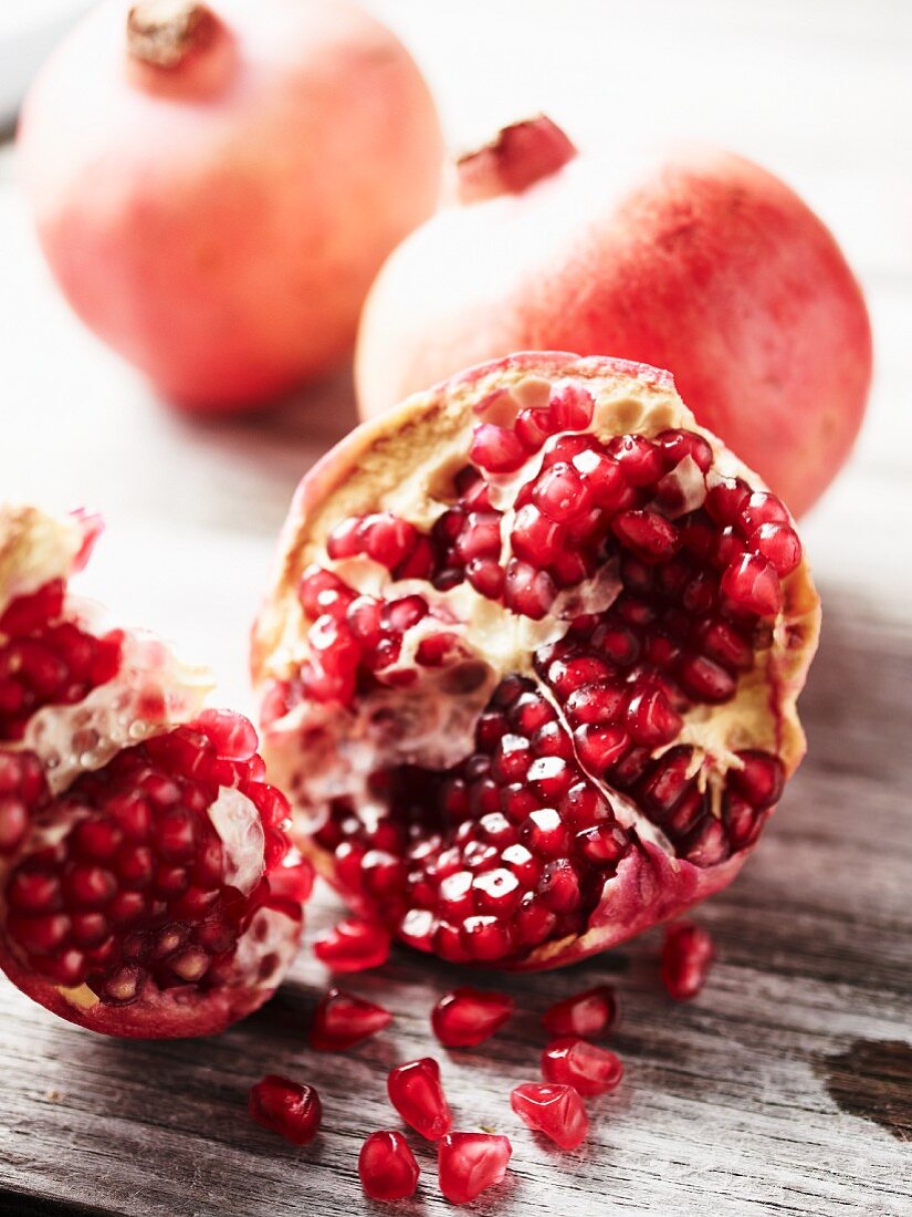 Pomegranates, whole and cut open