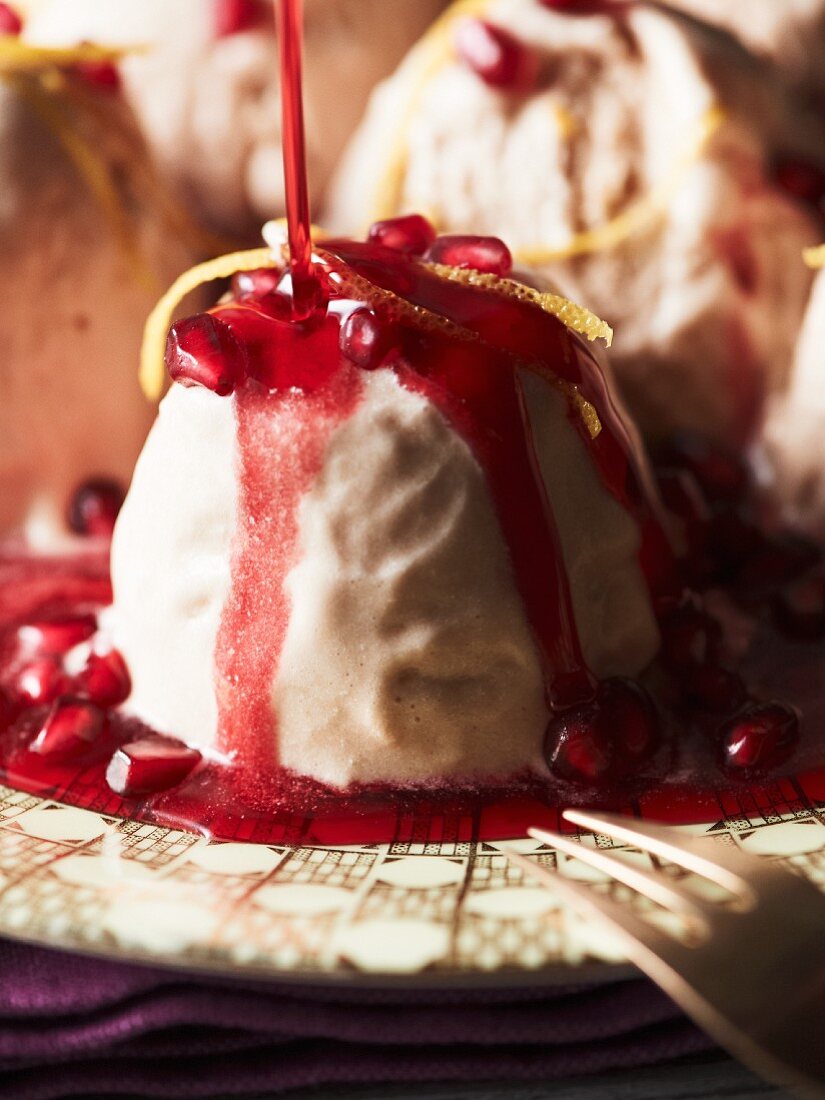 pomegranate parfait with orange zest and syrup