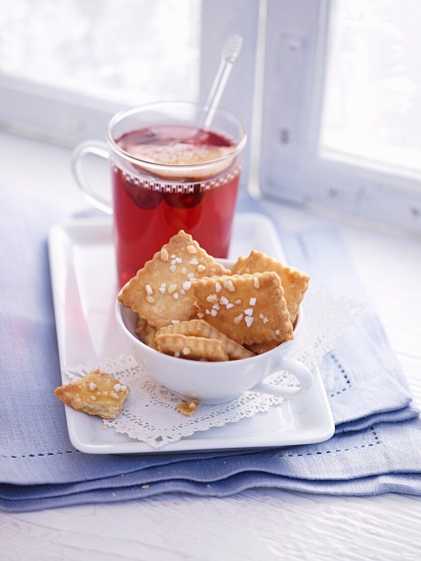 Biscuits with sugar crystals served with a cup of tea