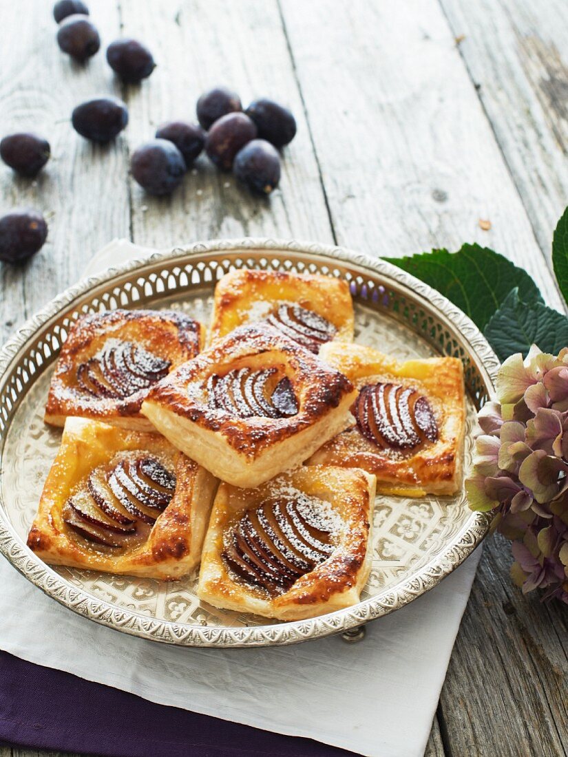 Flaky pastries with plums