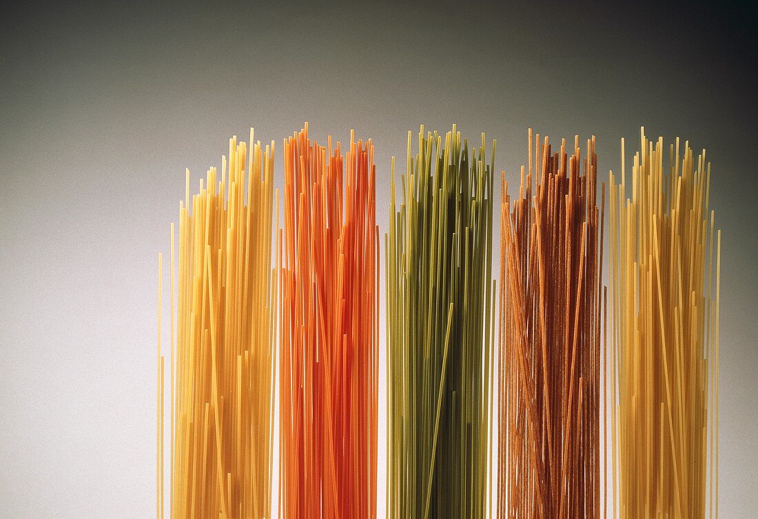 Several types of pasta: yellow, green, red, wholemeal spaghetti
