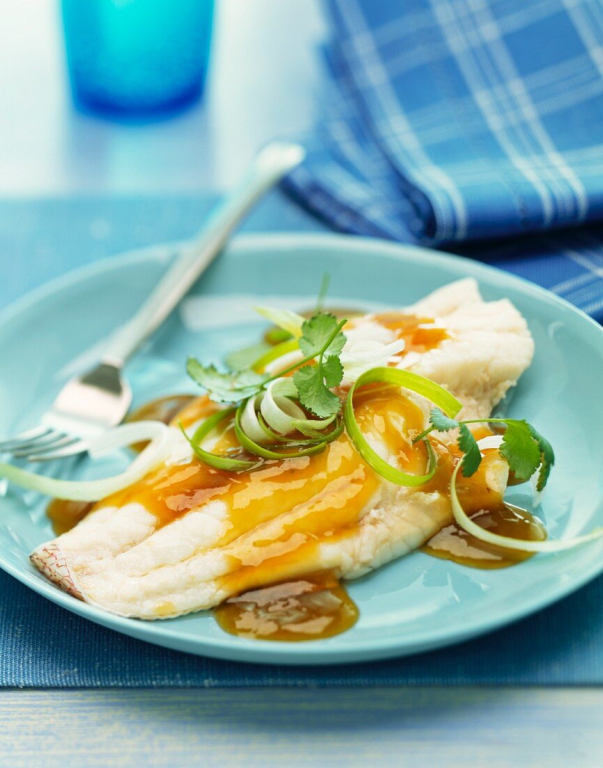 Sweet and sour sole fillets with spring onions