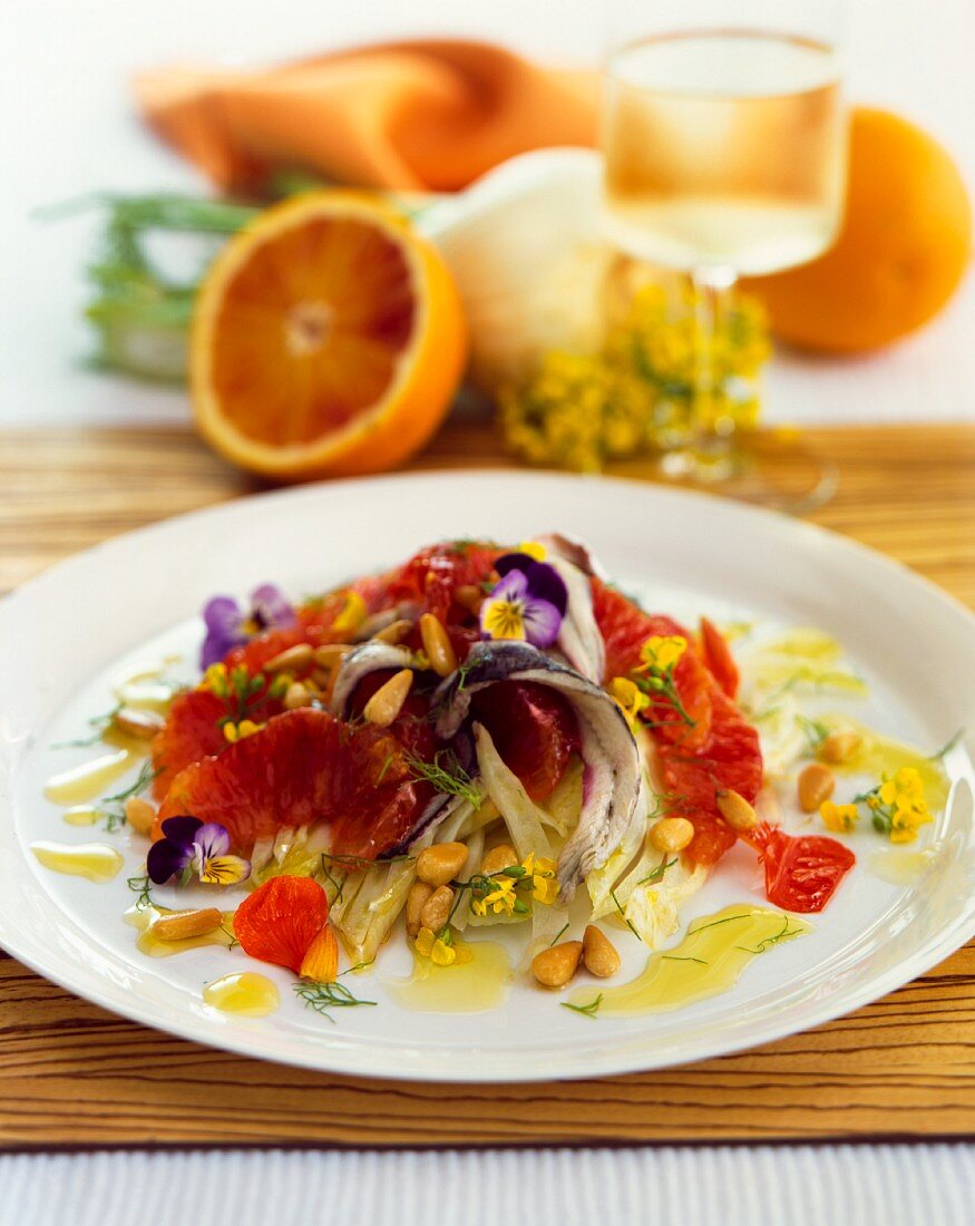Fennel salad with blood orange, pansies and pine nuts
