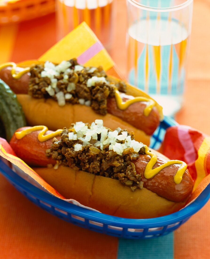 Chilli dogs with relish, onions and mustard
