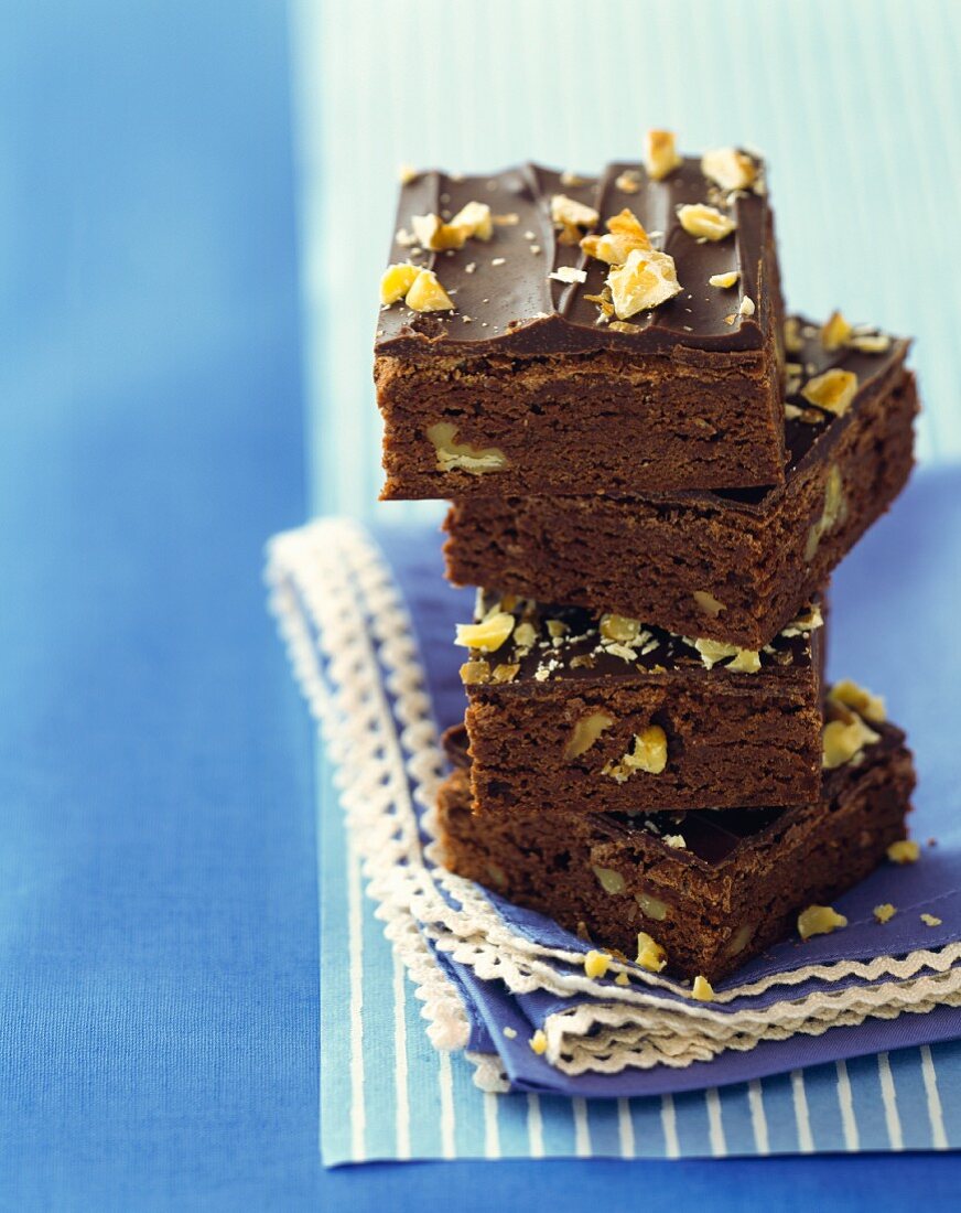 A stack of brownies with walnuts