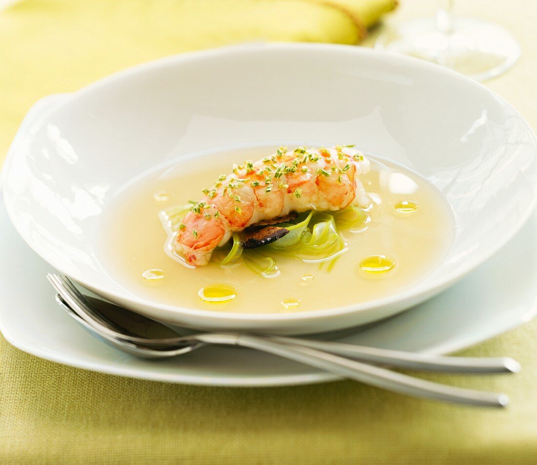 Lobster consommé with lobster flesh and tagliatelle