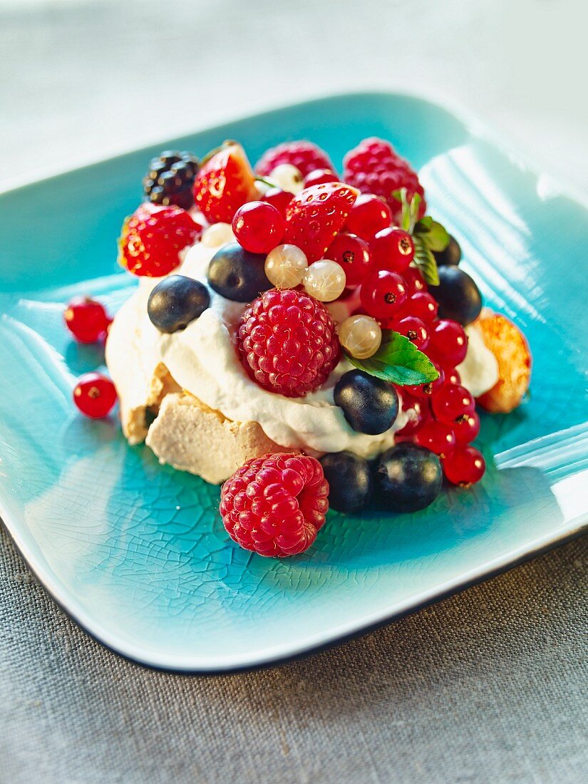 Meringue with cream and colourful berries