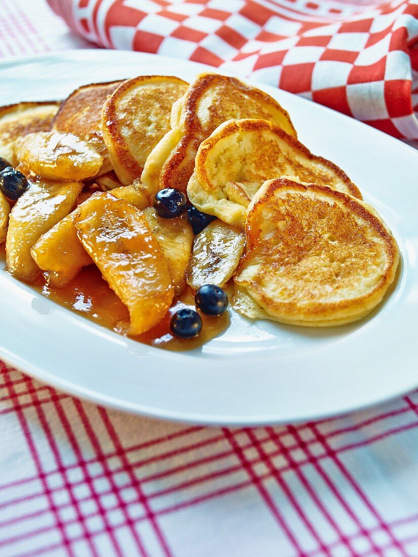 Liwanzen (Austrian pancakes) with banana caramel and blueberries