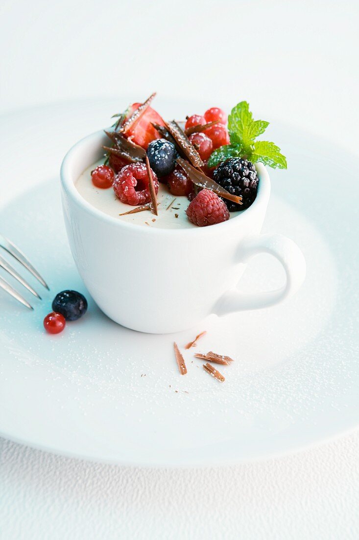 Cappuccino parfait with fresh berries and chocolate curls