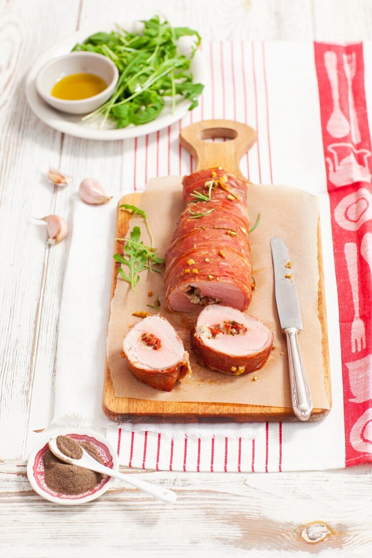 Stuffed pork fillet with dried tomatoes and gorgonzola wrapped in Proscuitto