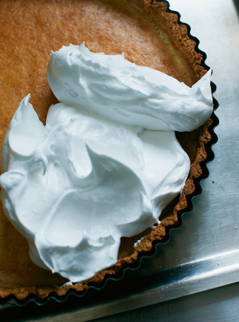 Lemon tart topped with unbaked meringue