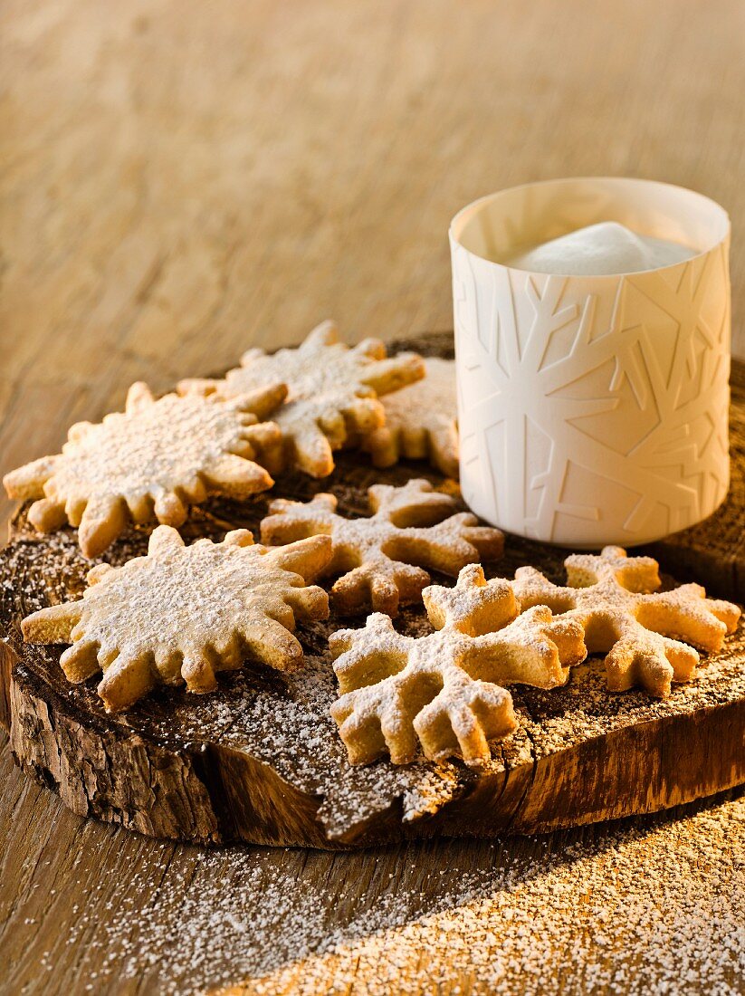 Anise and marzipan snowflakes with icing sugar