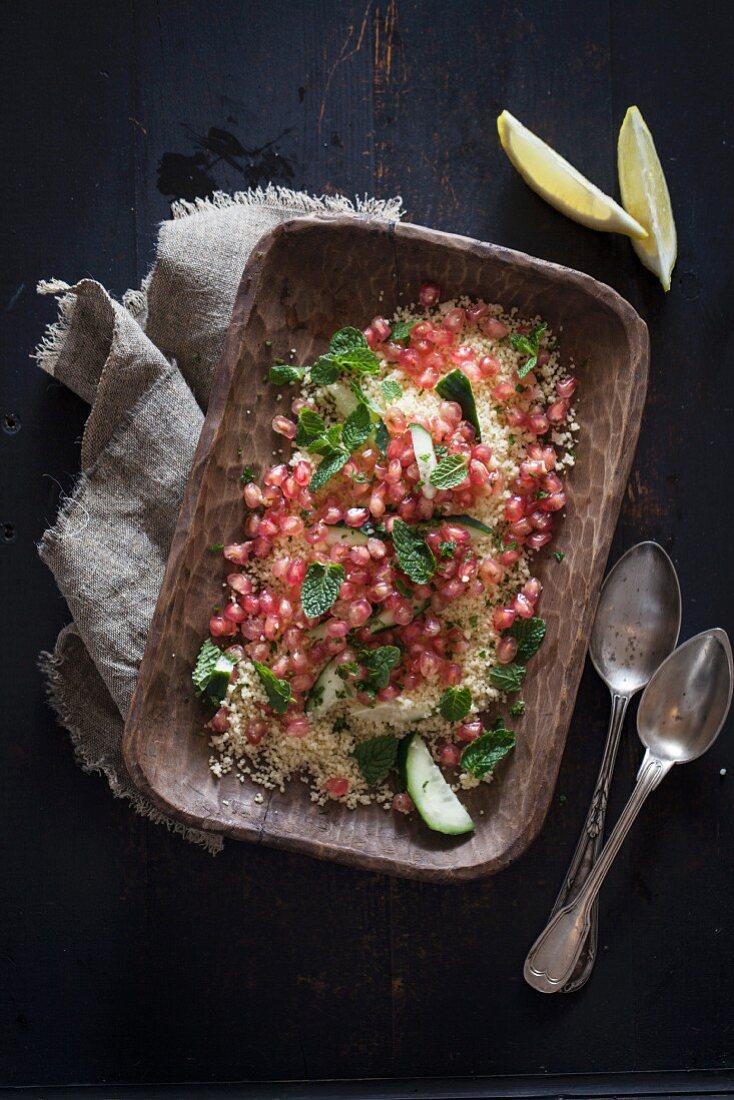 Couscous salad with pomegranate seeds and mint