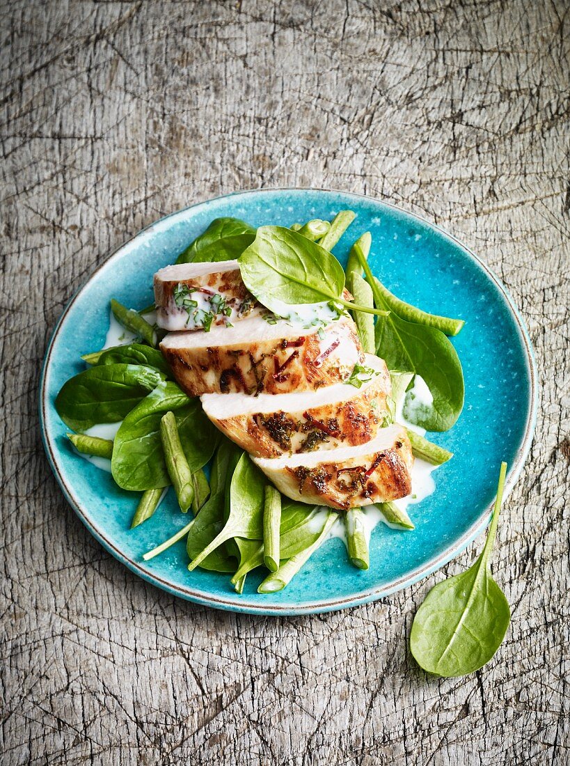 Chicken salad with a coconut and chilli dressing and spinach