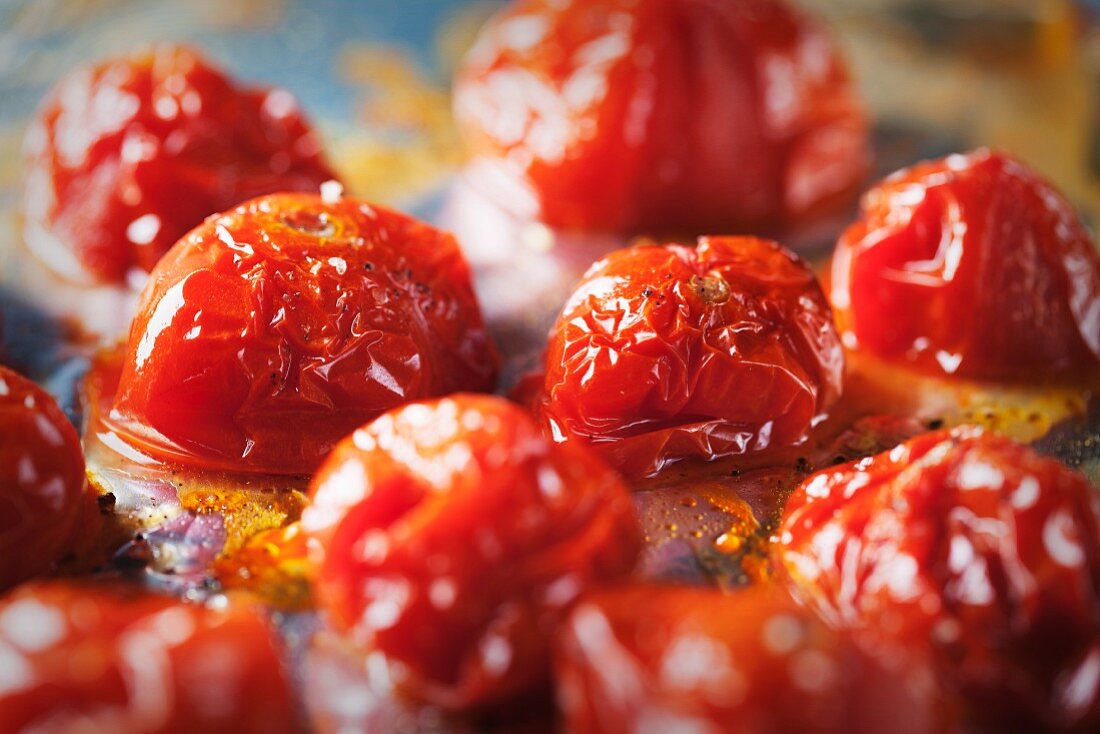 Oven-roasted cherry tomatoes on the baking tray