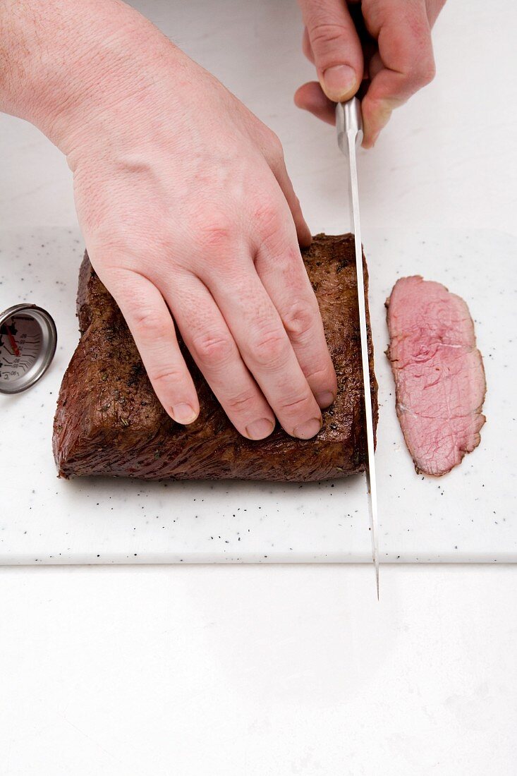 Roast beef being sliced