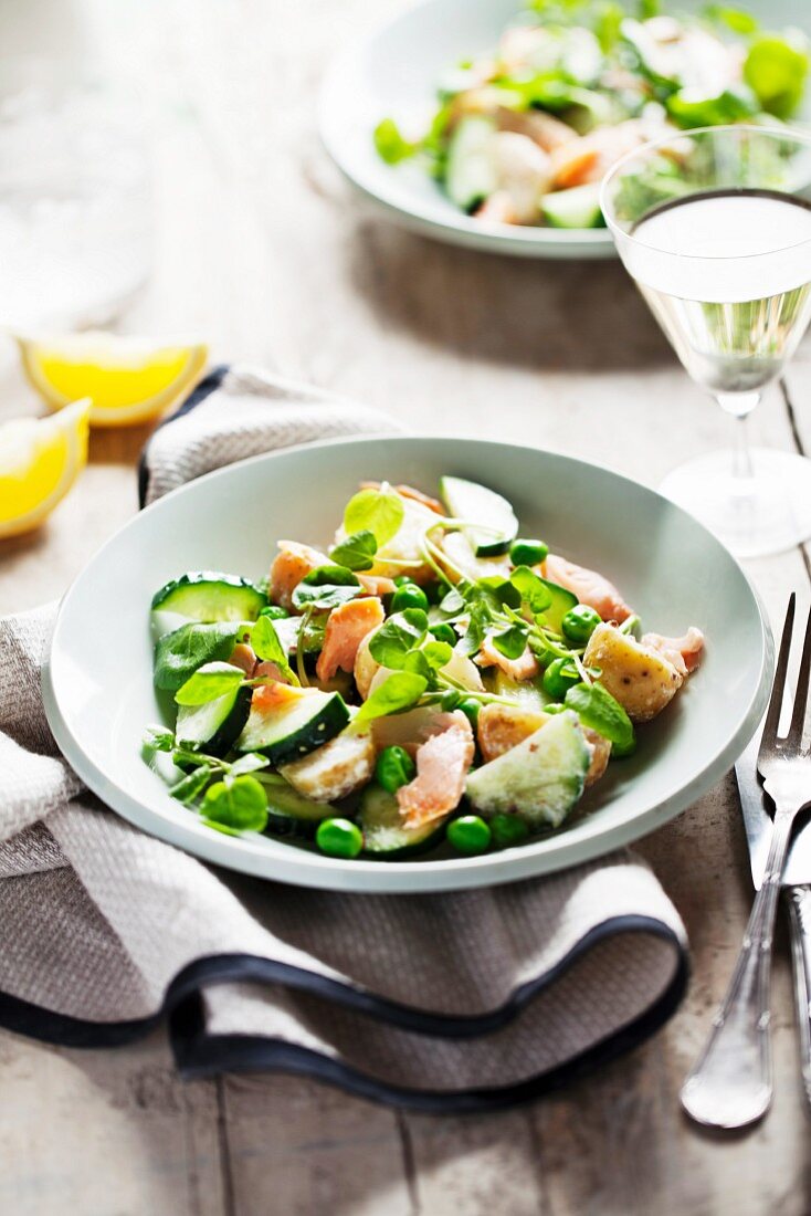 Salmon salad with peas and cucumber