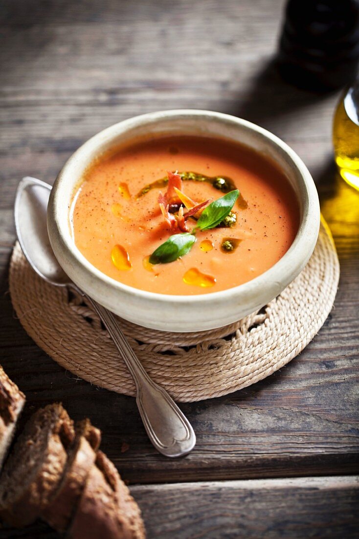 Tomato soup with pesto and basil