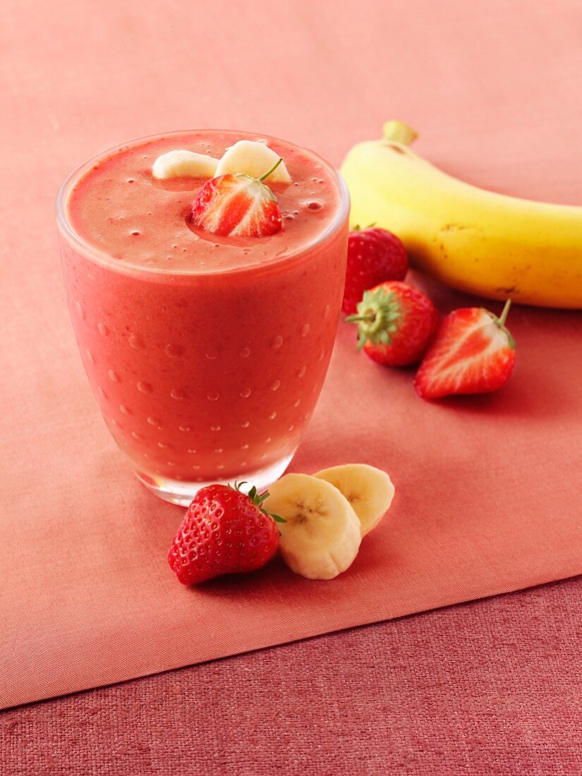 A glass of strawberry and banana smoothie