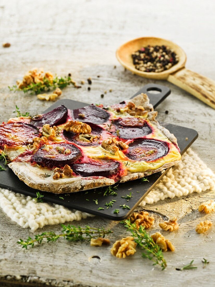 Tarte flambée with beetroot and walnuts