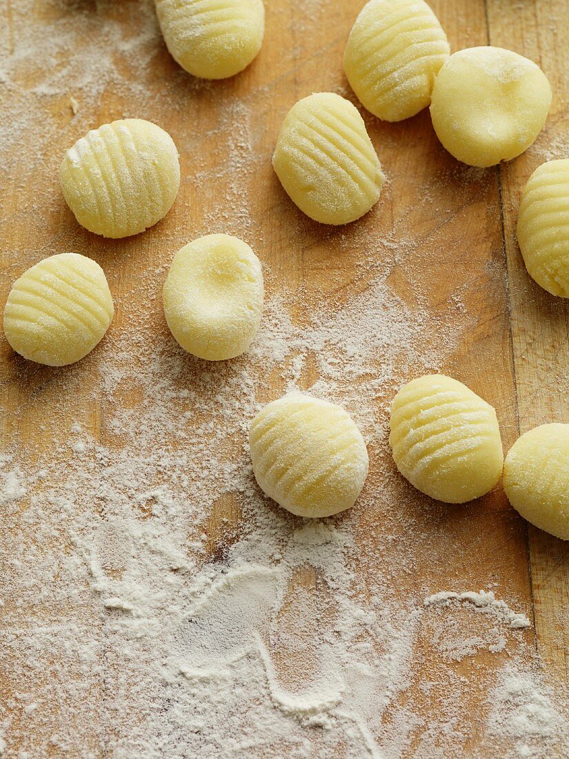 Raw gnocchi on a chopping board