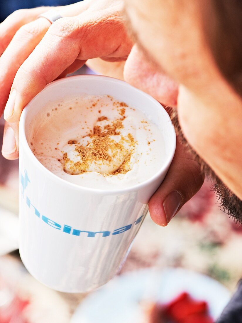 A chai latte with cream and cinnamon sugar