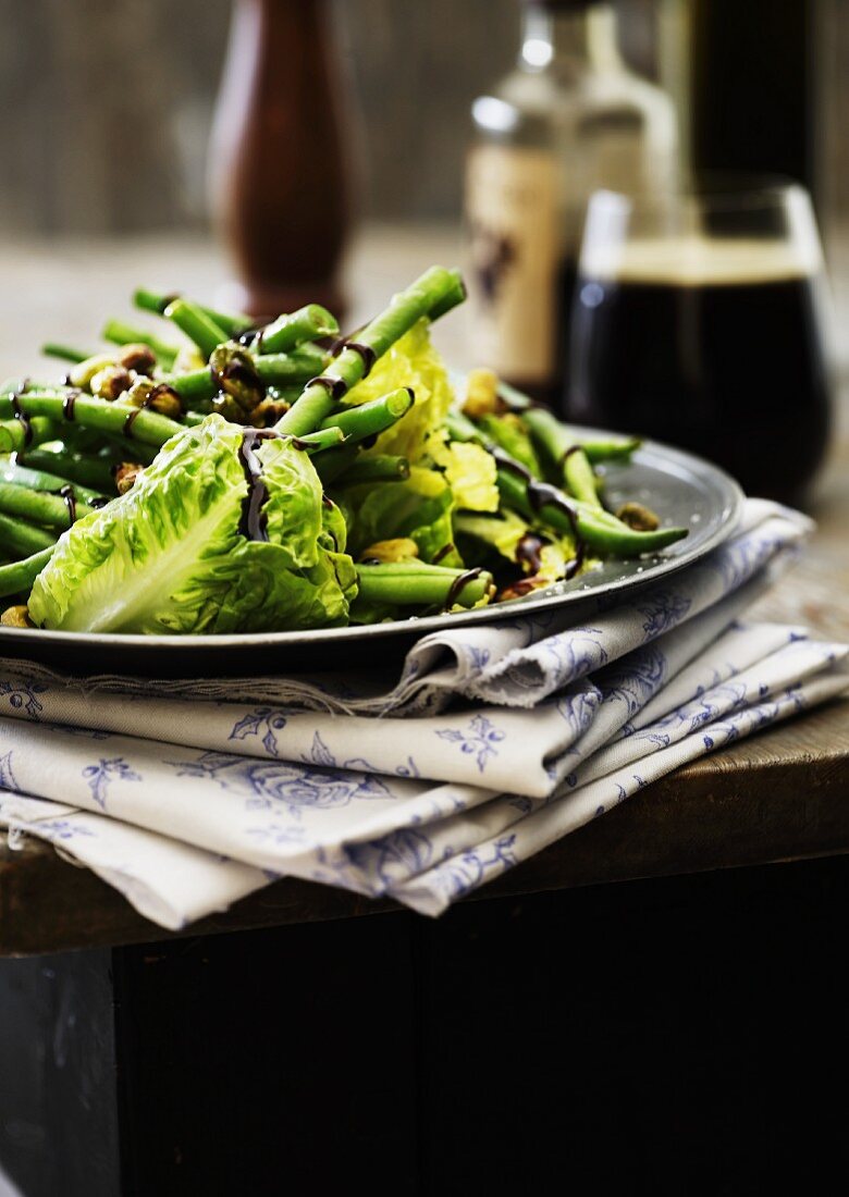 Green beans and cos lettuce with balsamic cream and pistachio nuts