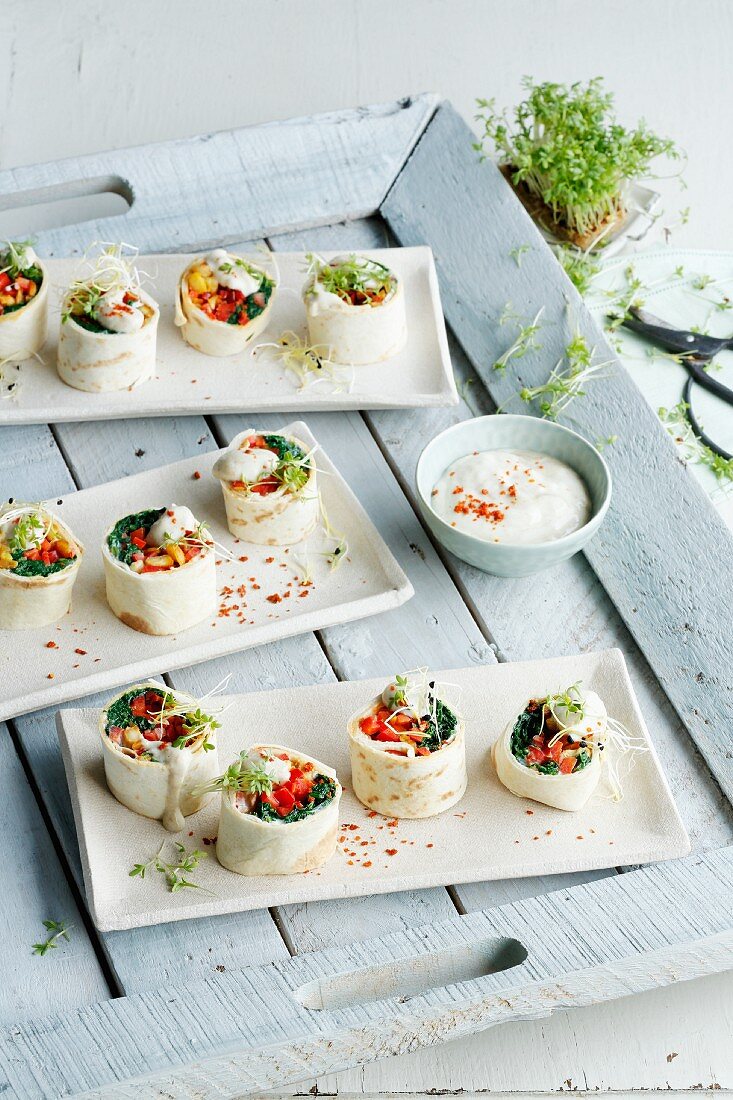 Chicken wraps filled with tempeh and vegetables
