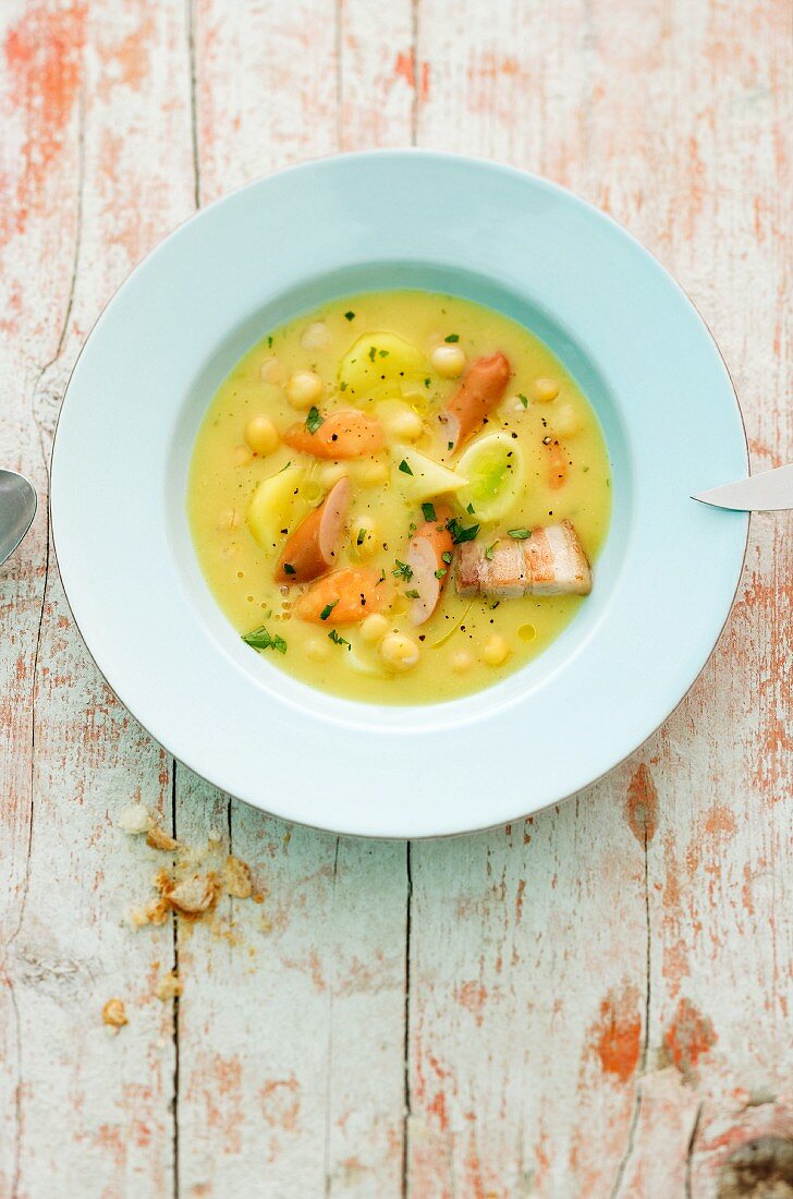 Yellow pea stew with pork belly and sausages