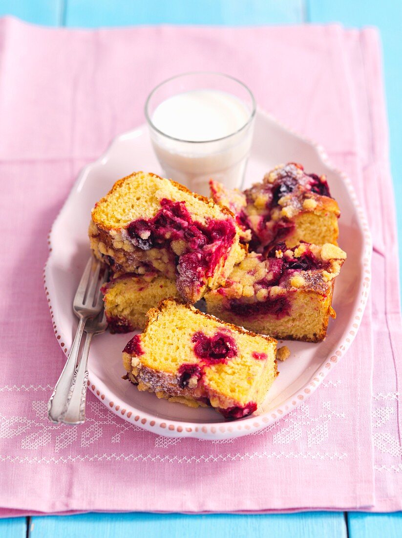 Yeast cake with sour cherries and a glass of milk