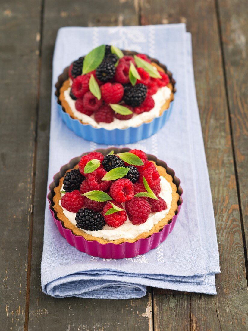 Mixed berry tarts with vanilla cream