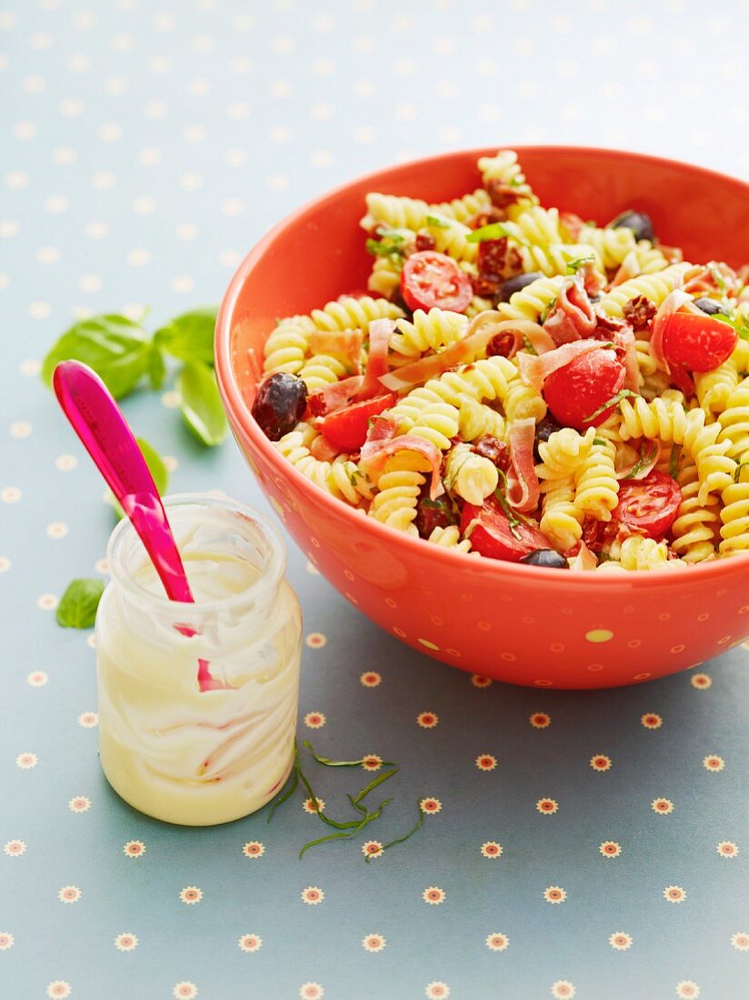 Mediterranean pasta salad with tomatoes and ham