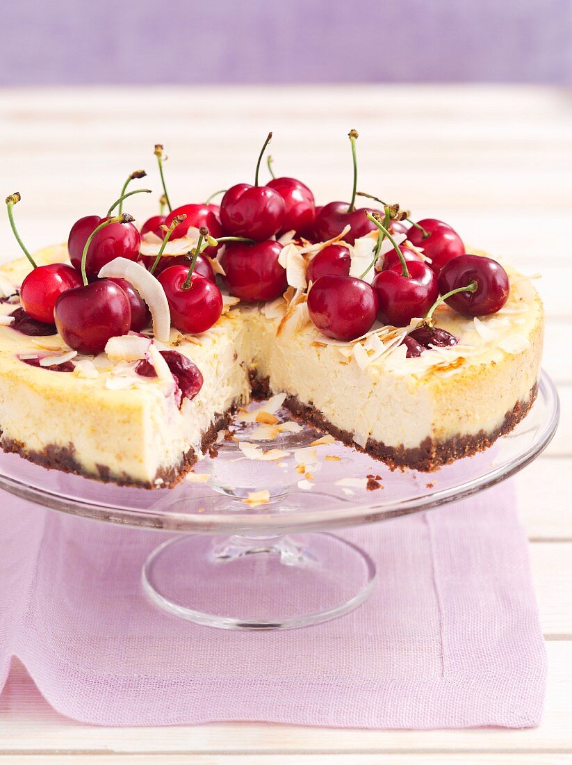 Ricotta cake with cherries and coconut, sliced