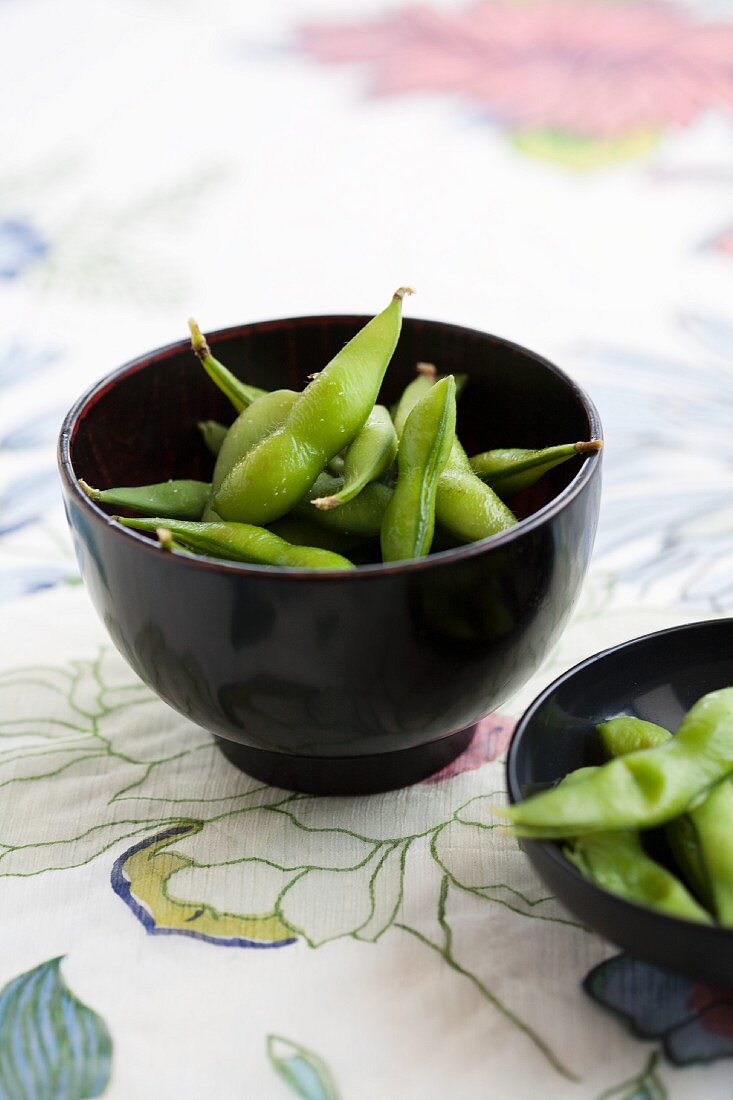 Cooked soya beans in black bowls (Japan)