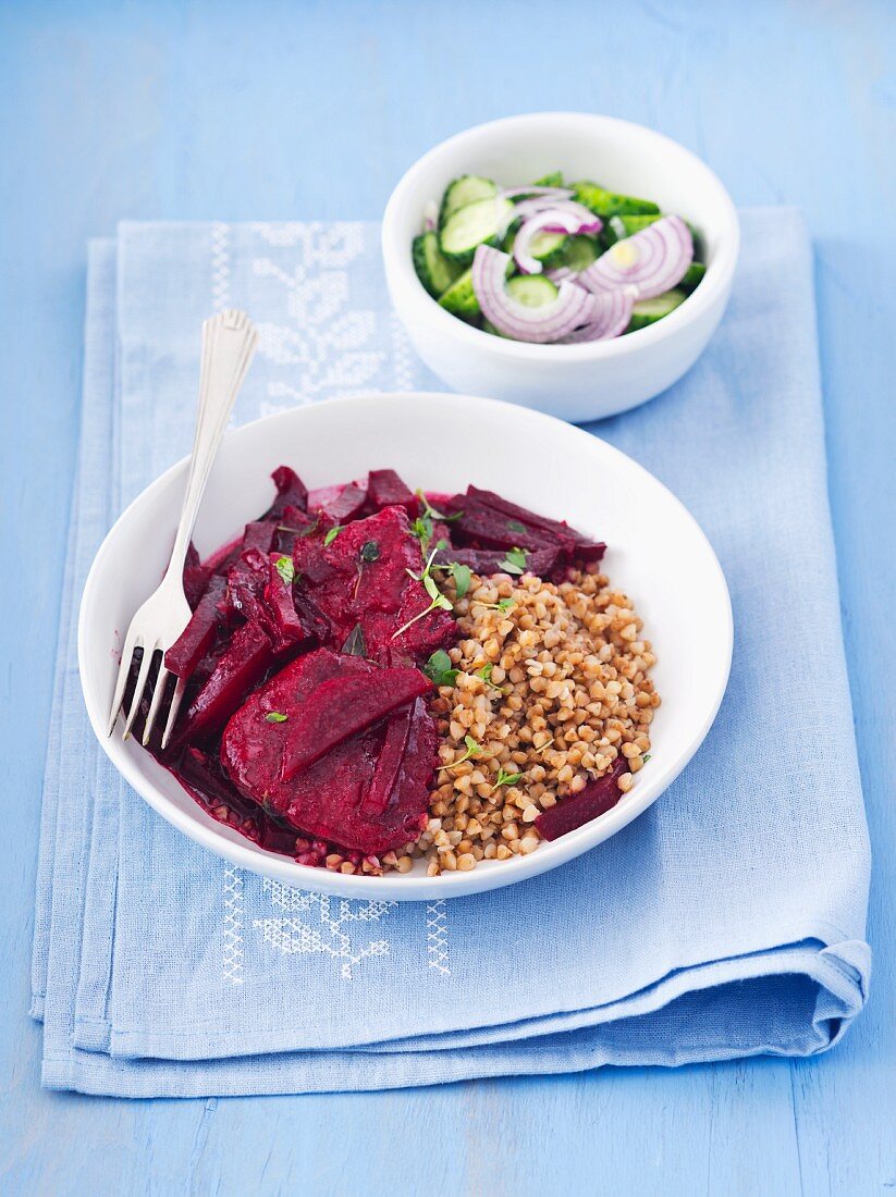 Pork braised in beetroot juice with buckwheat and cucumber salad