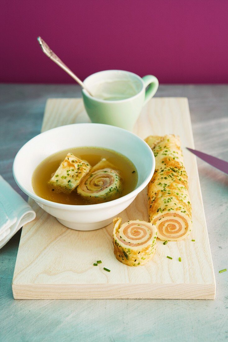 Vegetable stock with salmon pancake rolls