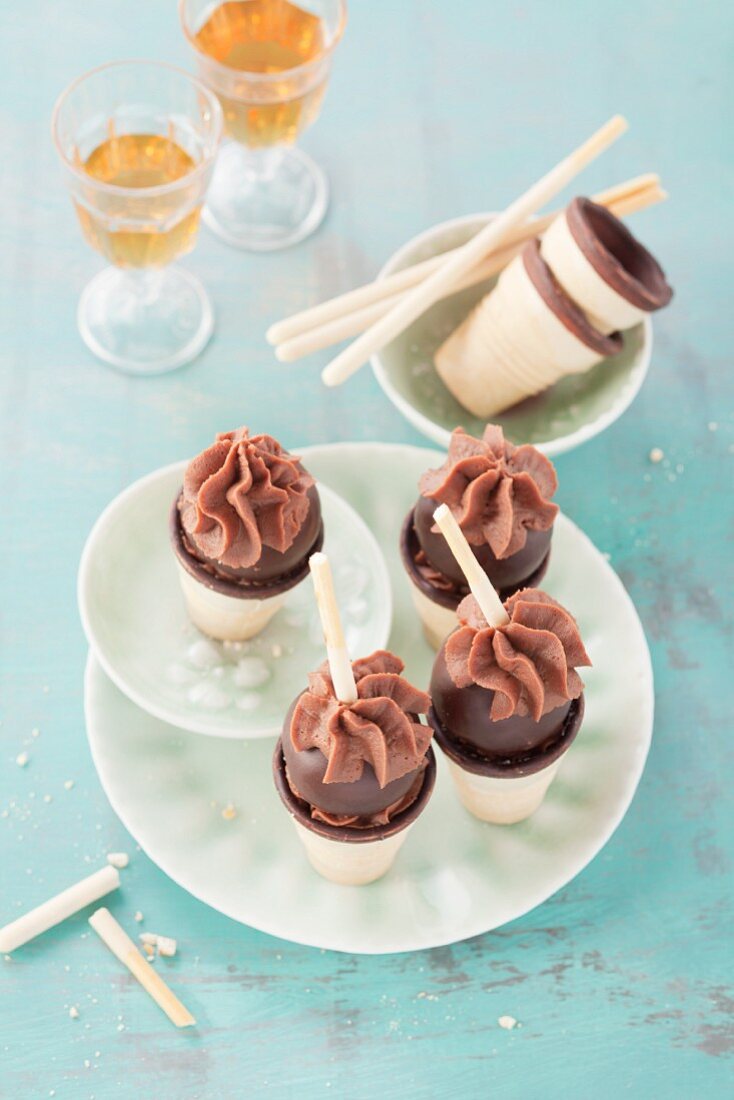 Cake pops with chocolate mousse in mini ice cream cones