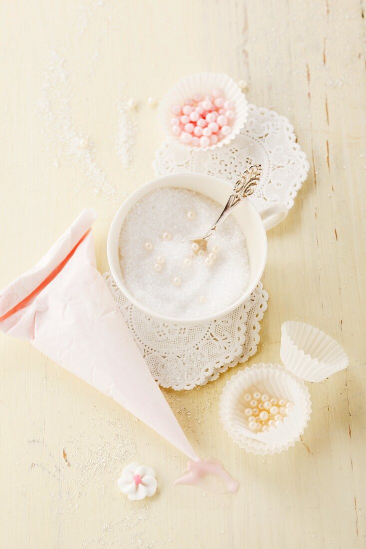 Icing sugar and sugar pearls for decorating cakes