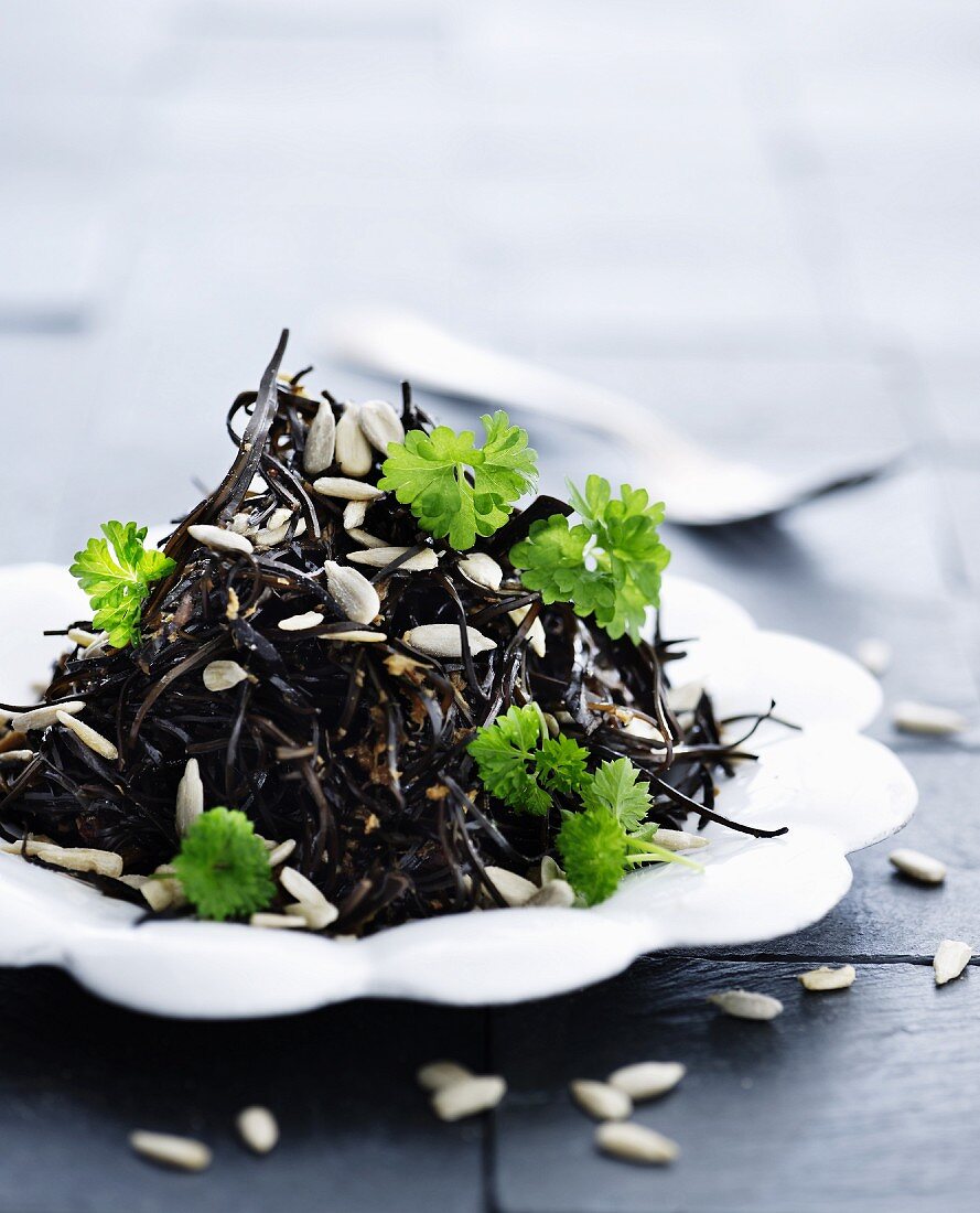 Seaweed salad with parsley and sunflower seeds