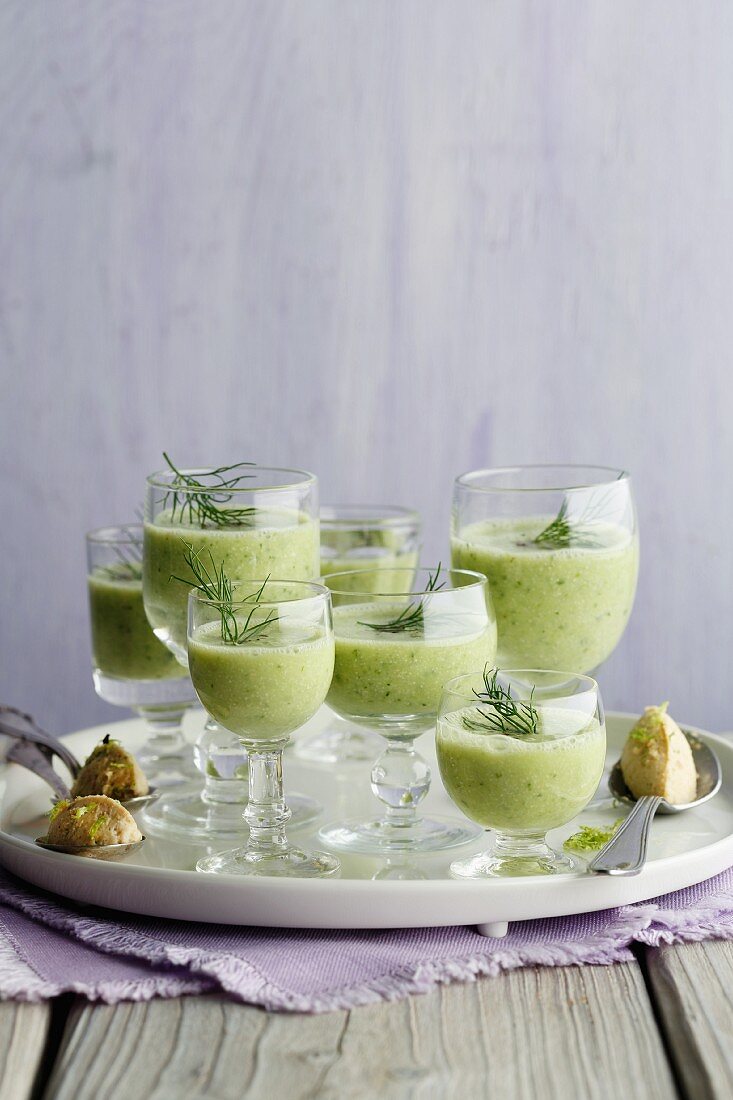 Cucumber and Riesling shots in glasses on a tray