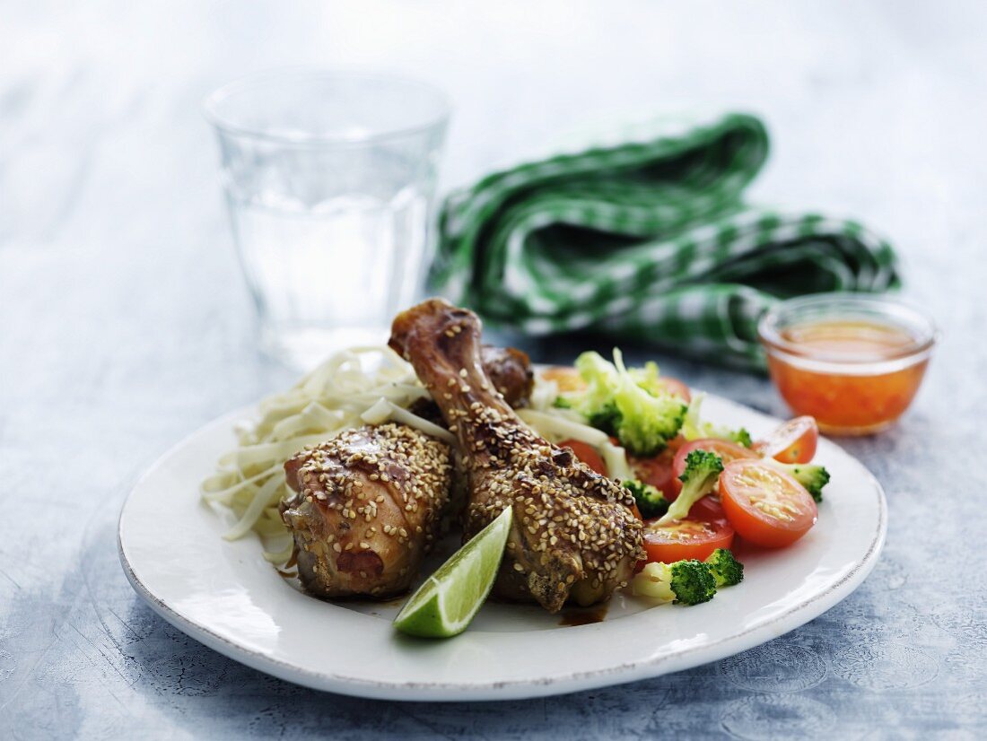 Chicken legs with sesame seeds and a side of vegetables for lunch